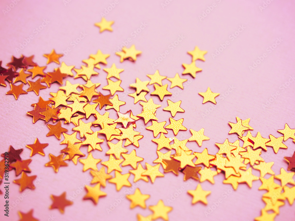 Golden stars glitter on pink background Golden stars glitter on pink background