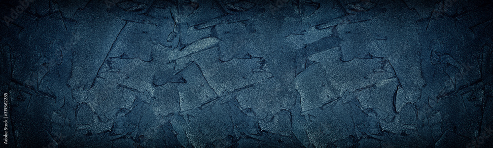 Navy blue cement strokes panoramic texture. Large wide dark grungy wall background