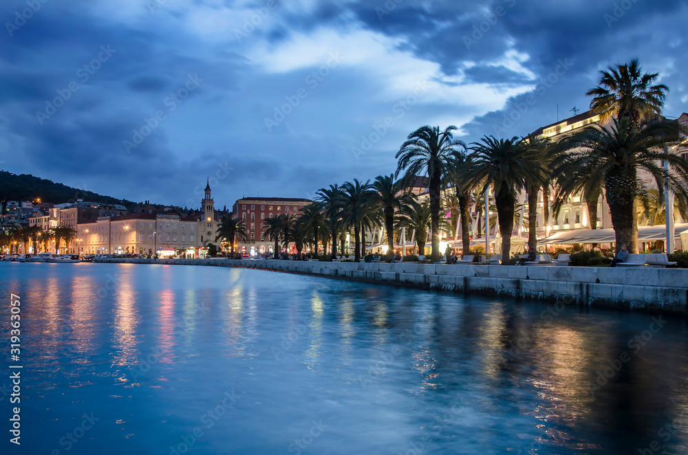 Beautiful Split city with the old town promenade and the Diocletian Palace at blue hour in Croatia, Dalmatia, Europe. Beautiful Split city with the old town promenade and the Diocletian Palace at blue hour in Croatia, Dalmatia, Europe.