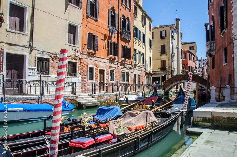 Traditional gondola in venetian water canal in Venice, Italy. Street in Venice