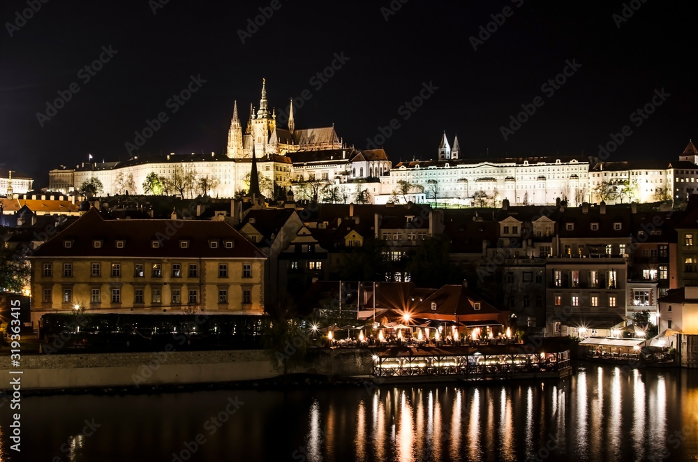 View of Prague Castle and Mala Strana at night, Prague, Czech Republic. Prague Castle evening scenery. Hradcany with St Vitus Cathedral after sunset. 