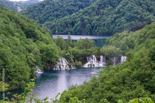 View from above of waterfall cascade with turquoise water in Plitvice Lakes National Park, Croatia photo