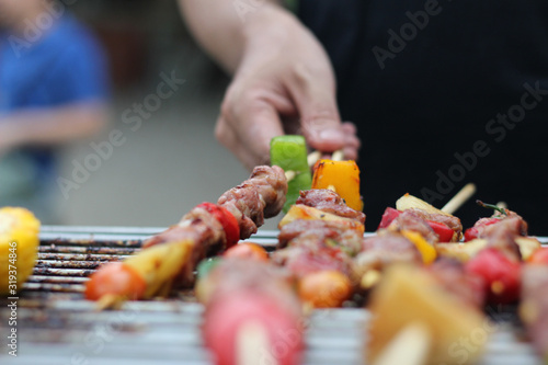 Men are barbecued in thailand,Eat outdoors in a happy family.