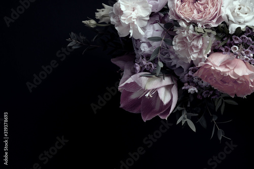 Beautiful bouquet of different flowers on black background, space for text. Floral card design with dark vintage effect