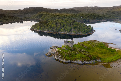 Aerial drone shot of Castle Tioram, it is a ruined castle that sits on the tidal island Eilean Tioram in Loch Moidart, Lochaber, Highland, Scotland. It is located west of Acharacle.