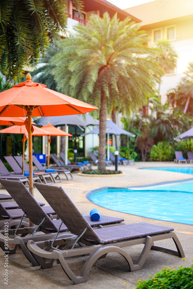 Fototapeta premium Deckchairs on beside swimming pool