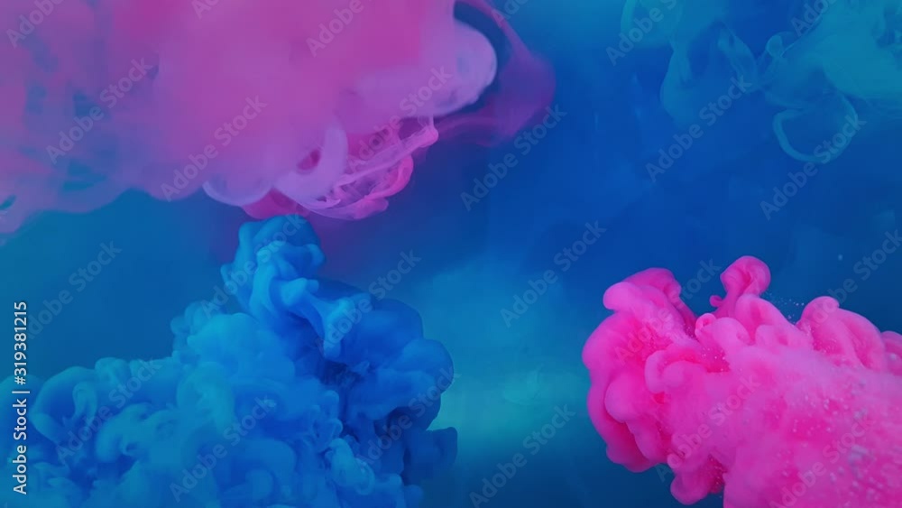 A beautiful mix of acrylic ink in water. The blue and pink ink forms abstract clouds when mixed. Acrylic clouds on a white background. Slow motion A beautiful mix of acrylic ink in water. The blue and pink ink forms abstract clouds when mixed. Acrylic clouds on a white background. Slow motion