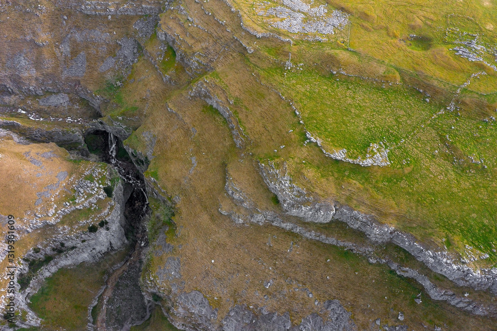 Drone shot show Gordale Beck a it travels through Gordale Scar, Malham, Yorkshire Dales National Park.UK Drone shot show Gordale Beck a it travels through Gordale Scar, Malham, Yorkshire Dales National Park.UK