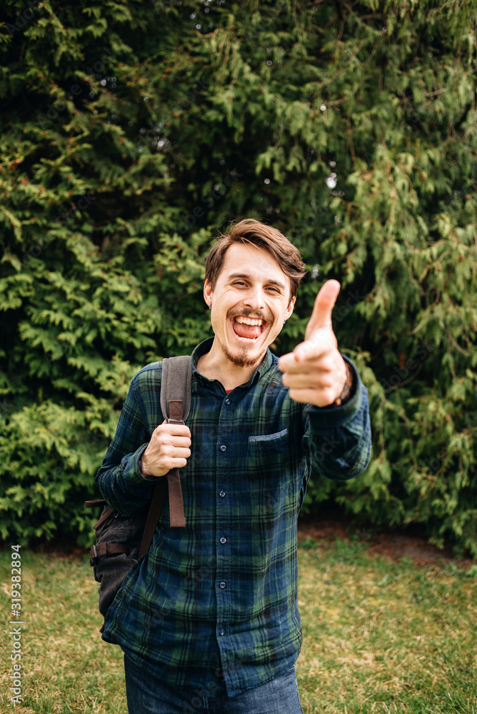 Happy hipster looking at camera on a summers day Happy hipster looking at camera on a summers day