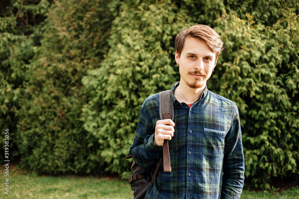 Happy hipster looking at camera on a summers day Happy hipster looking at camera on a summers day