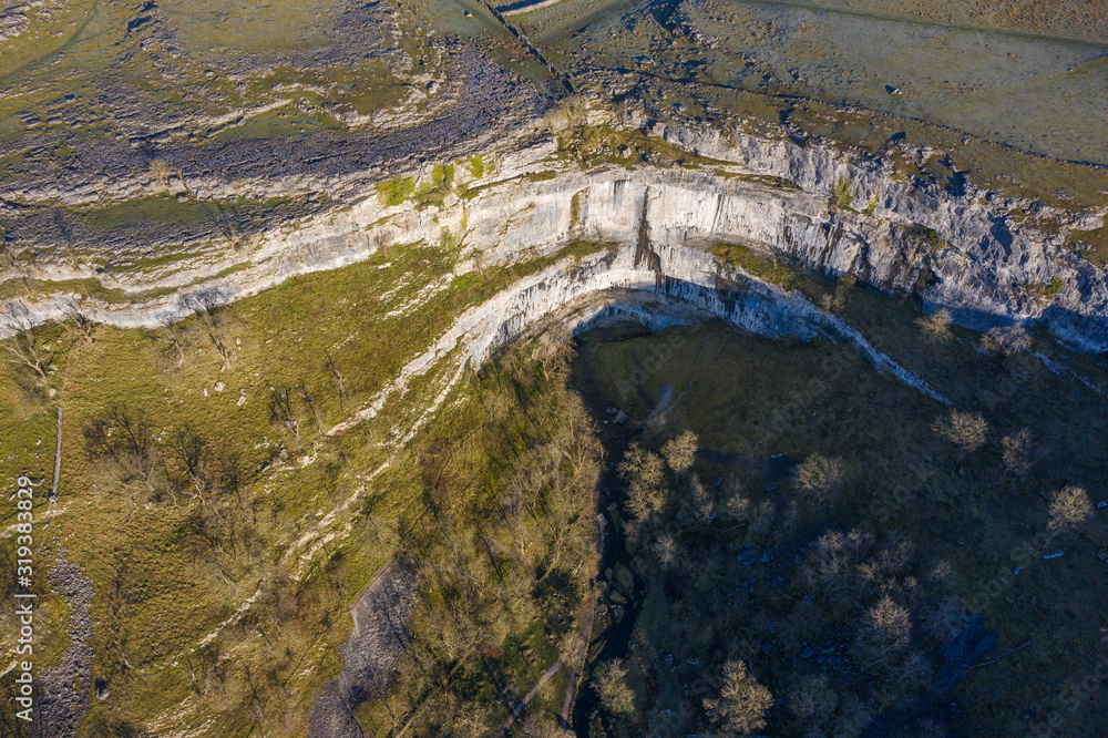 Malham Cove is a large curved limestone formation 0.6 miles north of the village of Malham, North Yorkshire