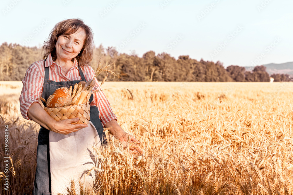 custom made wallpaper toronto digitalWoman with a basket of fresh home baking being in a wheat field. Golden ears of corn before harvest and a lady from the farm. Sunlight in the frame.