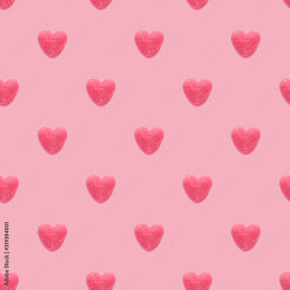 Seamless pattern with red marmalade hearts on a pink background