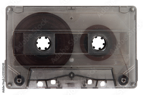 A compact audio cassette in a transparent enclosure is insulated against.