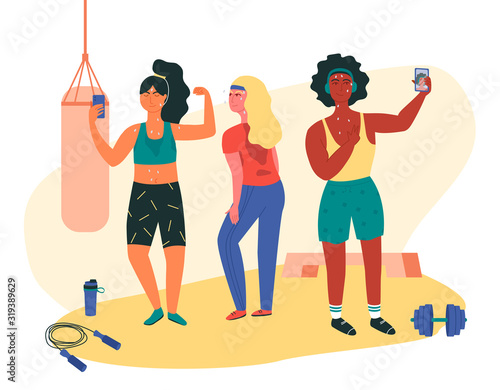 Three females doing sweaty selfie check-ins during gym session. Asian, black and white girls working out at fitness class with jump rope, dumbell, punching bag, platform. Functional training.