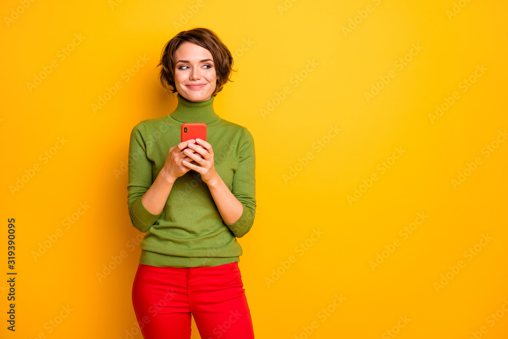 Portrait of positi8ve charming cunning girl use smartphone look good copyspace plan comment wear green red outfit isolated over shine color background Portrait of positi8ve charming cunning girl use smartphone look good copyspace plan comment wear green red outfit isolated over shine color background