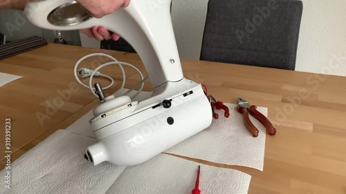 food processor repair, a man untwists a cover photo