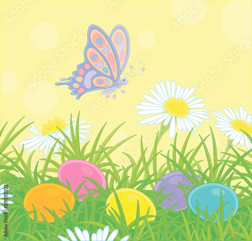 Small brightly colored butterfly flitting over wildflowers and decorated Easter eggs among thick green grass on a sunny spring day  vector cartoon illustration