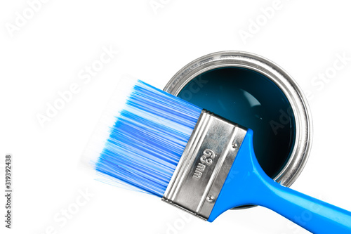  Can with blue  paint and brush isolated on white background top view