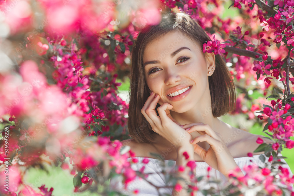 Beautiful lady on floral background. Woman with flowers. Poretait of gorgeous female in pink flowers. Beautiful lady on floral background. Woman with flowers. Poretait of gorgeous female in pink flowers.
