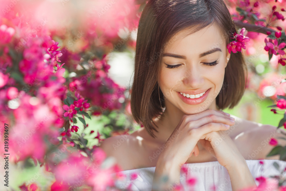 Beautiful lady on floral background. Woman with flowers. Poretait of gorgeous female in pink flowers. Beautiful lady on floral background. Woman with flowers. Poretait of gorgeous female in pink flowers.