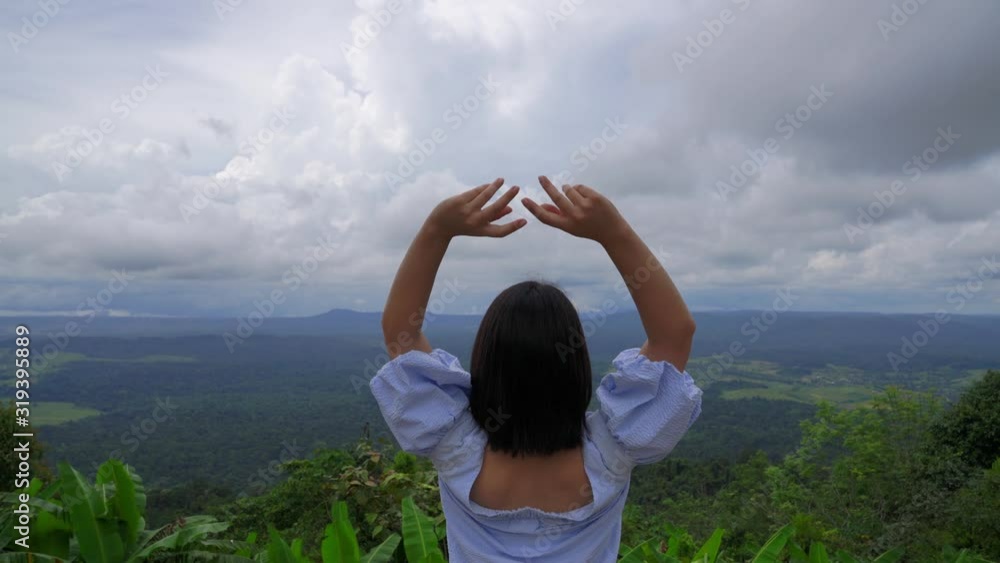 young japanese teen girl brunette tourist adult woman asian mature backpack looking the sky outdoors on a hike mountains viewpoint at khao kho, Phu Thap Boek, Phetchabun, Thailand. young japanese teen girl brunette tourist adult woman asian mature backpack looking the sky outdoors on a hike mountains viewpoint at khao kho, Phu Thap Boek, Phetchabun, Thailand.