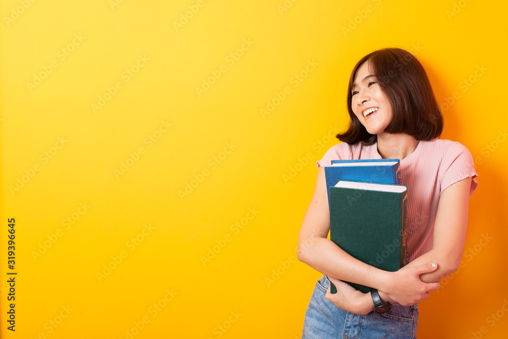 Beautiful asian woman University student happy on yellow background Beautiful asian woman University student happy on yellow background