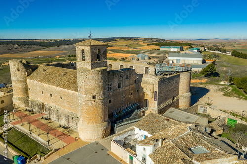 Aerial view of Garcimunoz medieval castle church where ancient architecture meets modern in Spain