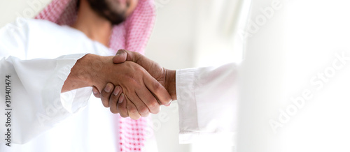 Valokuva Successful of arab business partner handshake together in modern office