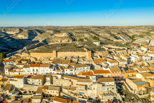 Aerial panoramic view of Jorquera town and castle above the Jucar river bend in Albacete province Spain