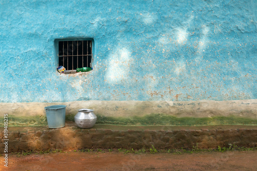 Grilled painted wall with Water vessel and bucket, Jagdalpur, Bastar, Chhattisgarh photo