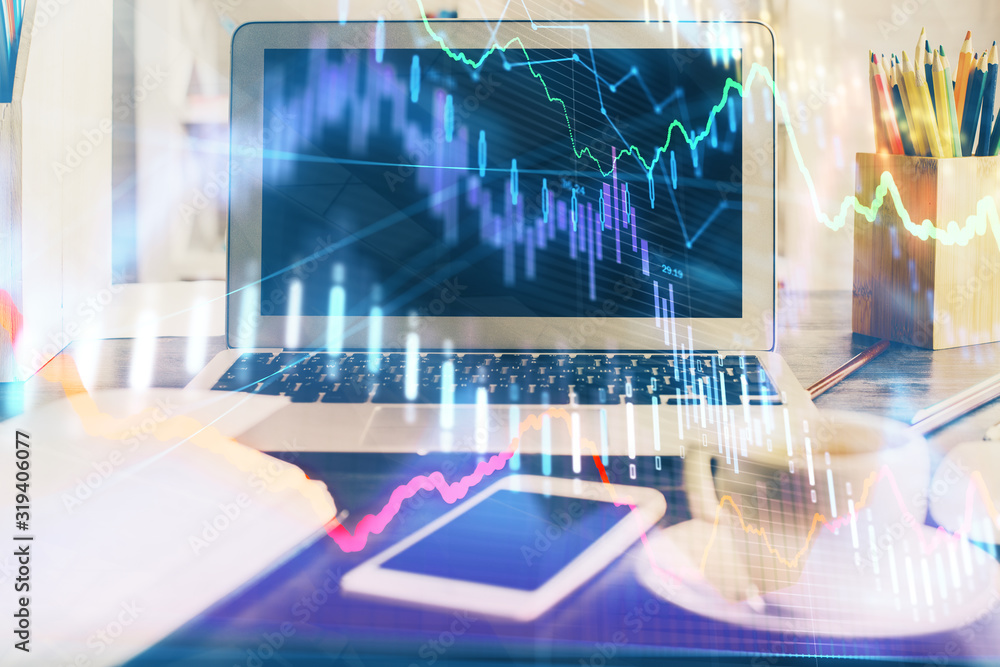 Forex market chart hologram and personal computer background. Double exposure. Concept of investment. Forex market chart hologram and personal computer background. Double exposure. Concept of investment.