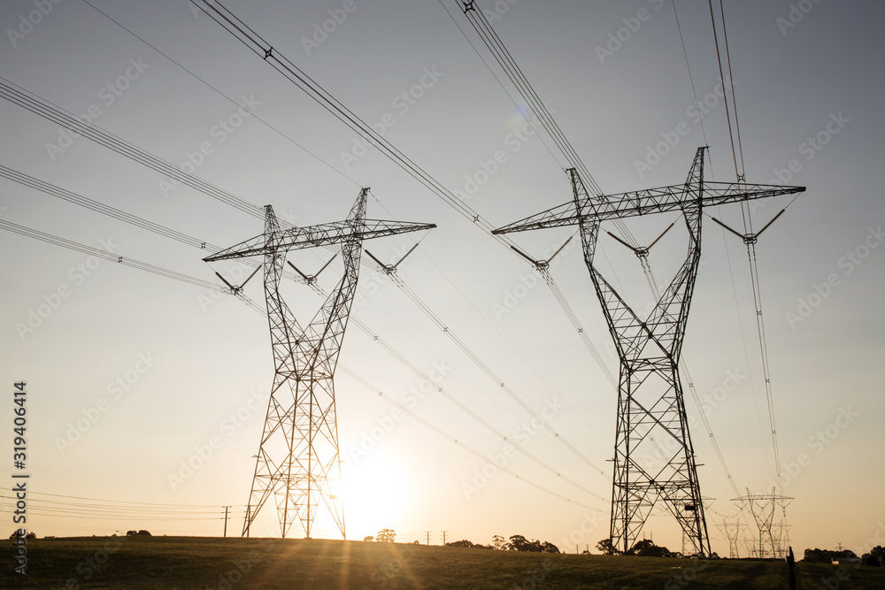 landscape of powerlines with sunset in background. landscape of powerlines with sunset in background.