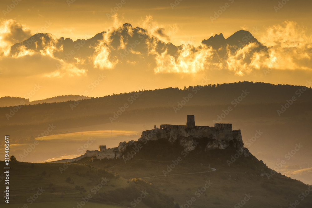 Spiski castle with Tatra Mountains as bacground in golden hour. Spiski castle with Tatra Mountains as bacground in golden hour.