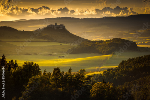 Spiski castle with Tatra Mountains as bacground in golden hour.