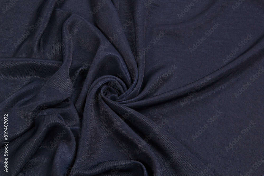 Fototapeta premium The fabric is blue silk. Blue textile drapery