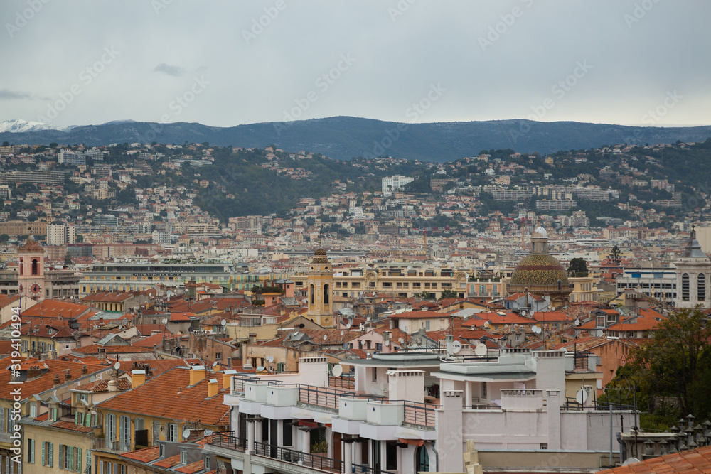 Obraz premium Top view on the roofs of Nice. Ancient architecture in Europe, old town.