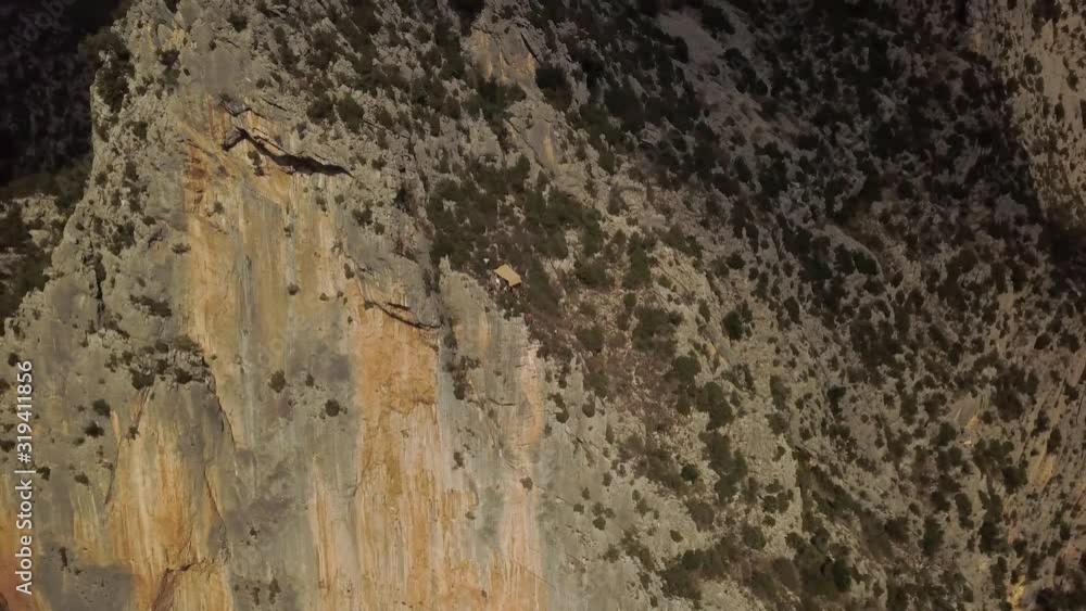 People with a tent have stopped to rest on the side of a mountains, alpinists 4k People with a tent have stopped to rest on the side of a mountains, alpinists 4k