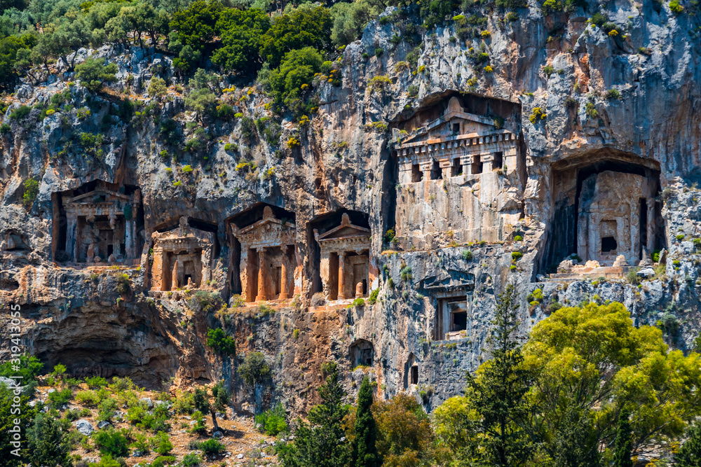 Obraz premium The ruins of ancient antique tombs of Lycian kings in modern Turkey.