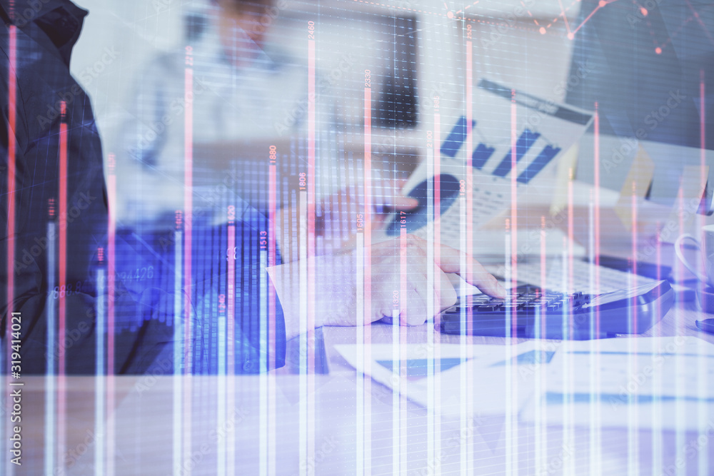 Double exposure of graph with man typing on computer in office on background. Concept of hard work. Closeup. Double exposure of graph with man typing on computer in office on background. Concept of hard work. Closeup.