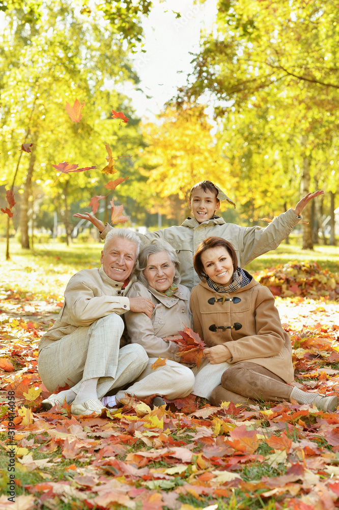Portrait of happy family relaxing in autumn forest Portrait of happy family relaxing in autumn forest