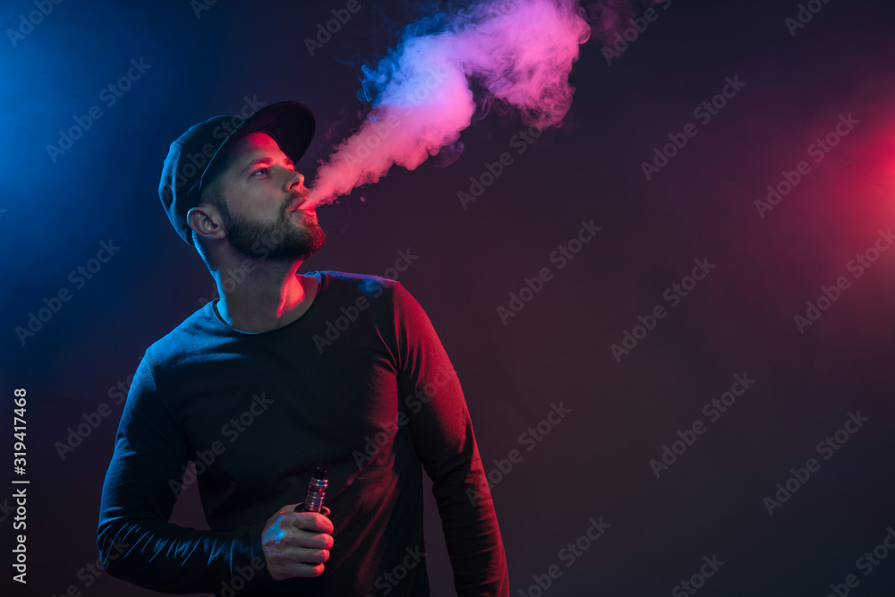 Vaping e-liquid from an electronic cigarette Vaping e-liquid from an electronic cigarette