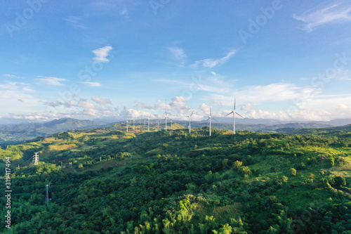 Aerial view of wind turbines and wind mills for electric power production in the Philippines, Luzon.