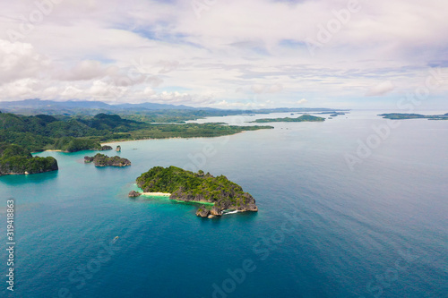 Seascape with islands. Caramoan Islands  Camarines Sur  Matukad. Philippines. Tropical island with a white sandy beach.