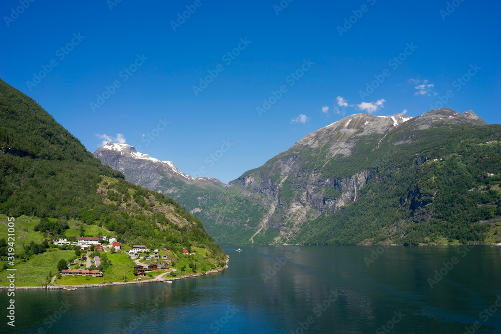 Geiranger is a small tourist village in Sunnmore region of Norway. Geiranger lies at the Geirangerfjord.