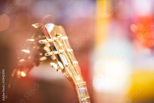 Strings of electric guitar.All-metal guitar.Electric guitar fretboard.selective focus.Image has a vintage effect applied.