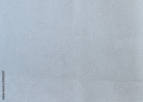 Gray fabric for embroidery with a cross close-up for the whole frame