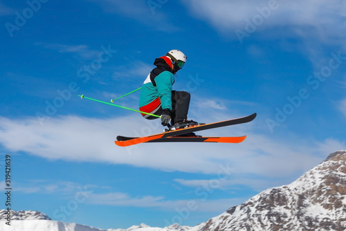 Male skier jumps in air