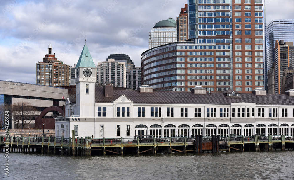 Naklejka premium City Pier A Harbour House seen from the Hudson River at Battery Park near the southern end of Manhattan.