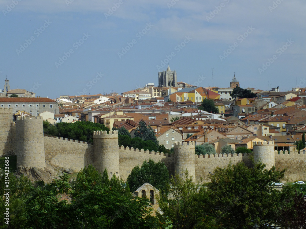 View of Ávila and its wall with intense blue sky